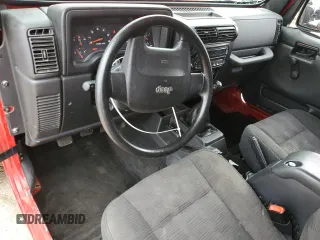 2005 Jeep Wrangler Sport z VIN 1J4FA49S75P317995, wystawiony jako Copart lot #58060055 z przebiegiem 189 332 mil mil oraz Szkoda całkowita • Salvage title. Historia ofert i sprzedaży dostępna na DreamBid. Obrazek 8.