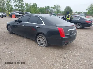 2014 Cadillac CTS Luxury AWD with VIN 1G6AX5SX9E0197395, listed as a IAAI auction lot 42211452 with 90,657 mi miles and . Bid and sale history available at DreamBid. Image 3.