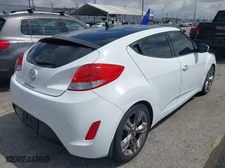 2015 Hyundai Veloster with VIN KMHTC6AD5FU231224, listed as a IAAI auction lot 41944186 with 103,124 mi miles. Bid and sale history available at carsss.com. Image 4.
