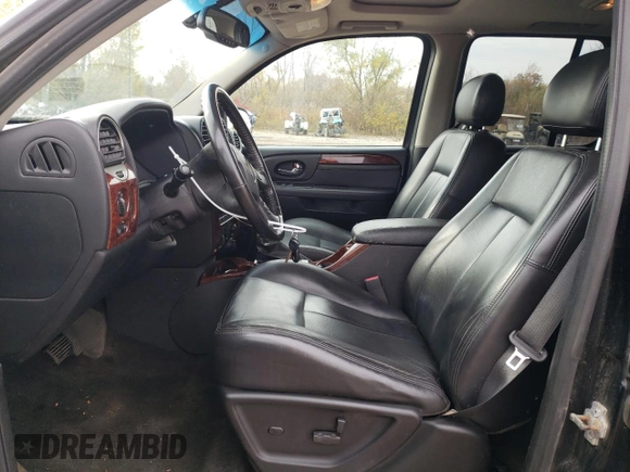2007 GMC Envoy SLT with VIN 1GKDT13S972197393, listed as a Copart auction lot 77958764 with 151,586 mi miles and Salvage Title. Bid and sale history available at DreamBid. Image 7.
