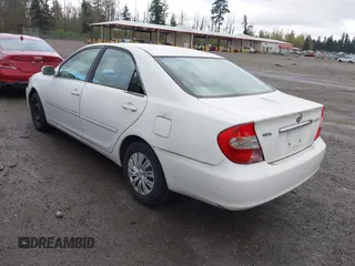 2004 Toyota Camry LE with VIN JTDBE32K840256161, listed as a IAAI auction lot 42000050 with 367,016 mi miles. Bid and sale history available at carsss.com. Image 3.
