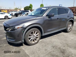 2019 Mazda CX-5 Grand Touring with VIN JM3KFADM6K1641992, listed as a Copart auction lot 57862345 with 37,100 mi miles and Salvage title. Bid and sale history available at DreamBid. Image 1.