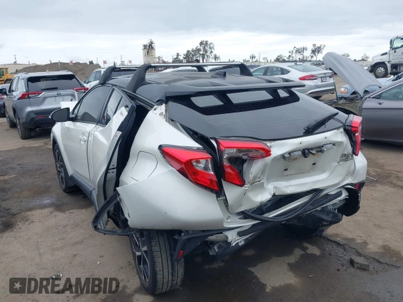 2020 Toyota C-HR LE with VIN JTNKHMBX9L1092934, listed as a IAAI auction lot 42021972 with 56,777 mi miles and . Bid and sale history available at DreamBid. Image 3.