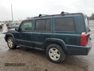 2006 Jeep Commander with VIN 1J8HH48NX6C125803, listed as a Copart auction lot 71247304 with 214,297 mi miles and Salvage Title. Bid and sale history available at carsss.com. Image 2.