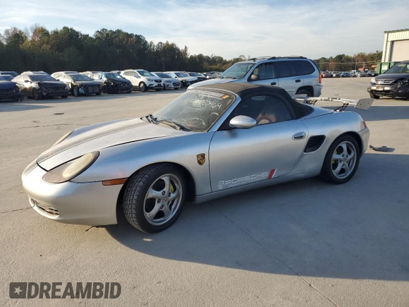 1998 Porsche Boxster с VIN WP0CA2987WS620369, выставлен на аукционе Copart как лот 81003964 с пробегом Не указан миль и Списание • Salvage title. История ставок и продаж доступна на DreamBid. Изображение 1.