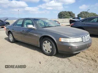1998 Cadillac Seville SLS z VIN 1G6KS54YXWU931108, wystawiony jako Copart lot #72369984 z przebiegiem 103 267 mil mil oraz Szkoda całkowita • Salvage title. Historia ofert i sprzedaży dostępna na DreamBid. Obrazek 4.