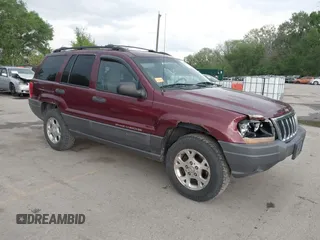 2001 Jeep Grand Cherokee Laredo z VIN 1J4GW48SX1C579597, wystawiony jako IAAI lot #42095153 z przebiegiem 180 770 mil mil oraz . Historia ofert i sprzedaży dostępna na DreamBid. Obrazek 1.