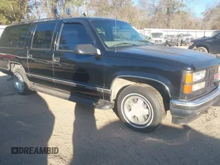 1999 GMC Suburban with VIN 3GKEC16R6XG549656, listed as a IAAI auction lot 41403259 with 306,548 mi miles. Bid and sale history available at carsss.com. Image 1.