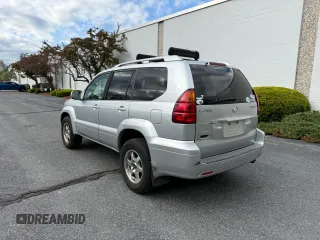 2006 Lexus GX 470 z VIN JTJBT20X860111393, wystawiony jako Copart lot #56594095 z przebiegiem 247 572 mil mil oraz Tytuł czysty. Historia ofert i sprzedaży dostępna na DreamBid. Obrazek 3.