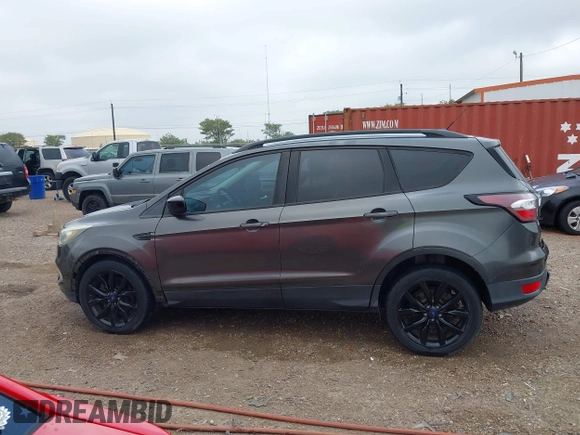 2017 Ford Escape SE with VIN 1FMCU0G99HUC65571, listed as a IAAI auction lot 41923517 with 77,179 mi miles and . Bid and sale history available at DreamBid. Image 14.