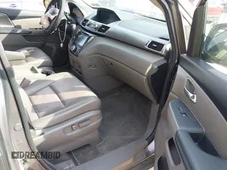 2014 Honda Odyssey Touring with VIN 5FNRL5H92EB073085, listed as a IAAI auction lot 42065913 with 120,834 mi miles and . Bid and sale history available at DreamBid. Image 5.