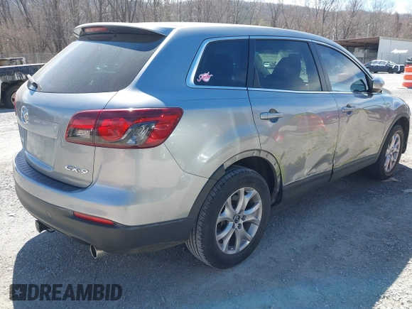 2015 Mazda CX-9 Sport with VIN JM3TB2BA7F0450544, listed as a IAAI auction lot 41812565 with 81,727 mi miles and . Bid and sale history available at carsss.com. Image 4.