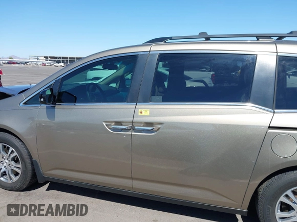 2012 Honda Odyssey EX-L z VIN 5FNRL5H63CB033049, wystawiony jako IAAI lot #42260501 z przebiegiem 165 693 mil mil oraz . Historia ofert i sprzedaży dostępna na DreamBid. Obrazek 15.