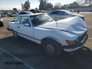 1987 Mercedes-Benz 560 SL with VIN WDBBA48D8HA066224, listed as a Copart auction lot 87976835 with 196,054 mi miles and Salvage Title. Bid and sale history available at DreamBid. Image 4.