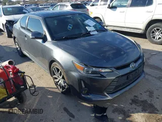 2014 Scion tC with VIN JTKJF5C74E3082094, listed as a IAAI auction lot 41355759 with 130,952 mi miles. Bid and sale history available at carsss.com. Image 1.
