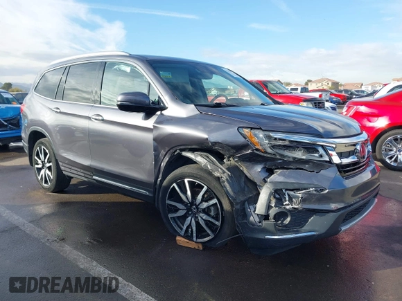 2019 Honda Pilot Touring 7-Passenger z VIN 5FNYF5H65KB020420, wystawiony jako IAAI lot #41575972 z przebiegiem 48 950 mil mil oraz . Historia ofert i sprzedaży dostępna na DreamBid. Obrazek 1.