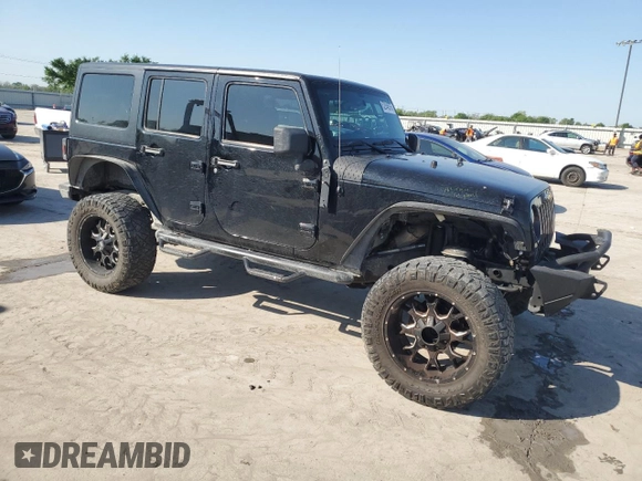 2013 Jeep Wrangler Unlimited Freedom z VIN 1C4BJWDG0DL513902, wystawiony jako Copart lot #52045975 z przebiegiem 166 827 mil mil oraz Szkoda całkowita • Salvage title. Historia ofert i sprzedaży dostępna na DreamBid. Obrazek 4.