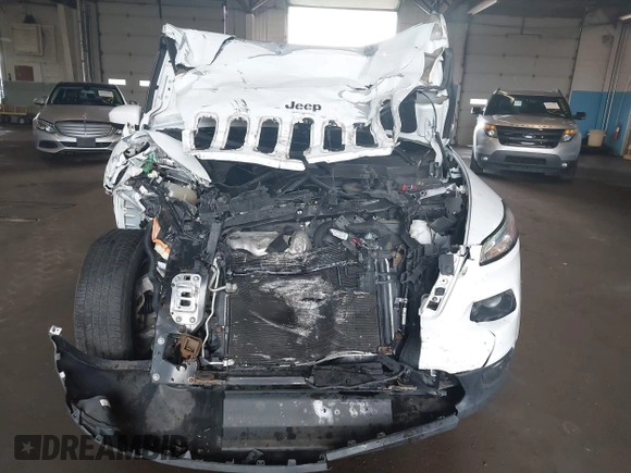 2015 Jeep Cherokee Latitude with VIN 1C4PJMCBXFW784869, listed as a IAAI auction lot 41951297 with 138,396 mi miles. Bid and sale history available at carsss.com. Image 6.