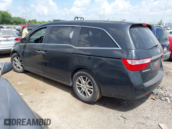 2011 Honda Odyssey EX-L with VIN 5FNRL5H62BB063125, listed as a IAAI auction lot 42562541 with 140,787 mi miles and . Bid and sale history available at DreamBid. Image 3.