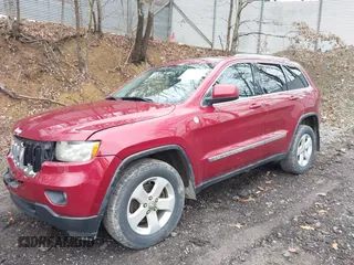 2012 Jeep Grand Cherokee Laredo with VIN 1C4RJFAG7CC123669, listed as a IAAI auction lot 42001472 with 164,806 mi miles. Bid and sale history available at carsss.com. Image 2.