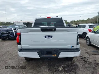 2024 Ford F-150 Lightning XLT with VIN 1FTVW3LKXRWG01185, listed as a IAAI auction lot 41679606 with 4,961 mi miles and . Bid and sale history available at DreamBid. Image 17.
