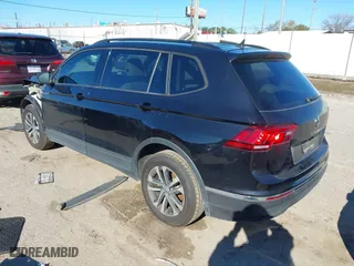 2022 Volkswagen Tiguan S with VIN 3VV1B7AX7NM107779, listed as a IAAI auction lot 41210258 with 57,154 mi miles. Bid and sale history available at carsss.com. Image 3.