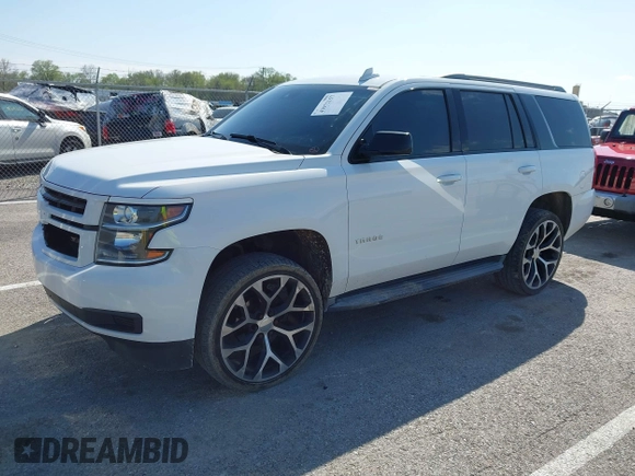 2015 Chevrolet Tahoe LT with VIN 1GNSCBKCXFR552071, listed as a IAAI auction lot 41972157 with 214,738 mi miles and . Bid and sale history available at DreamBid. Image 18.