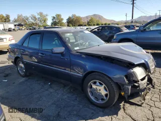 1996 Mercedes-Benz C with VIN WDBHA28E5TF406948, listed as a Copart auction lot 80234944 with 239,256 mi miles and Salvage Title. Bid and sale history available at carsss.com. Image 4.