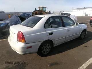 2004 Hyundai Accent GL with VIN KMHCG45C04U498939, listed as a IAAI auction lot 41384821 with 247,994 mi miles. Bid and sale history available at carsss.com. Image 4.