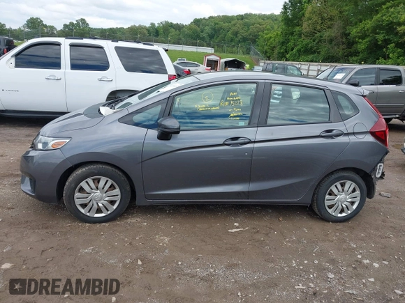 2015 Honda Fit LX z VIN 3HGGK5H59FM714352, wystawiony jako IAAI lot #42156097 z przebiegiem 103 587 mil mil oraz . Historia ofert i sprzedaży dostępna na DreamBid. Obrazek 14.