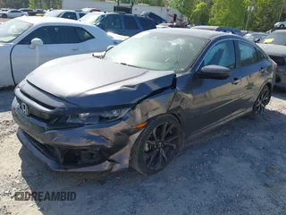 2019 Honda Civic Sport with VIN 2HGFC2F8XKH598141, listed as a IAAI auction lot 42013724 with 98,401 mi miles and . Bid and sale history available at DreamBid. Image 2.