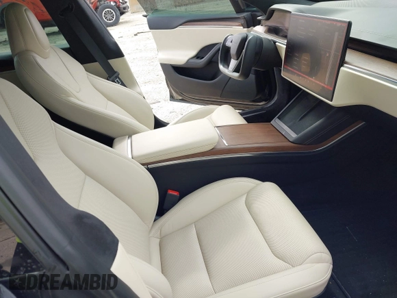 2022 Tesla Model S with VIN 5YJSA1E51NF472152, listed as a IAAI auction lot 42625943 with 60,290 mi miles and . Bid and sale history available at DreamBid. Image 5.