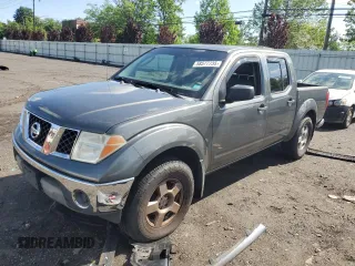 2005 Nissan Frontier LE z VIN 1N6AD07W65C433635, wystawiony jako Copart lot #58577735 z przebiegiem 159 077 mil mil oraz Szkoda całkowita • Salvage title. Historia ofert i sprzedaży dostępna na DreamBid. Obrazek 1.