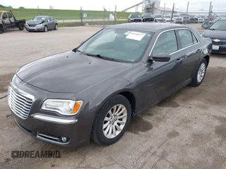 2013 Chrysler 300 with VIN 2C3CCAAG9DH707447, listed as a IAAI auction lot 42292077 with 171,329 mi miles and . Bid and sale history available at DreamBid. Image 2.