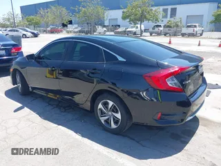 2020 Honda Civic LX with VIN 19XFC2F66LE213975, listed as a IAAI auction lot 42398098 with 69,902 mi miles and . Bid and sale history available at DreamBid. Image 3.