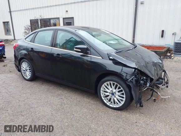 2014 Ford Focus Titanium with VIN 1FADP3J25EL310199, listed as a IAAI auction lot 40682901 with 84,885 mi miles and . Bid and sale history available at DreamBid. Image 1.