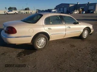 1998 Lincoln Continental with VIN 1LNFM97V3WY647762, listed as a Copart auction lot 77062294 with 153,553 mi miles and Salvage Title. Bid and sale history available at carsss.com. Image 3.