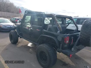 2009 Jeep Wrangler Unlimited Rubicon z VIN 1J4GA69159L749215, wystawiony jako IAAI lot #41489893 z przebiegiem 177 768 mil mil oraz . Historia ofert i sprzedaży dostępna na DreamBid. Obrazek 3.