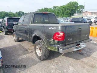 2001 Ford F-150 XLT with VIN 1FTRW08L61KD90032, listed as a IAAI auction lot 42385610 with 164,252 mi miles and . Bid and sale history available at DreamBid. Image 3.