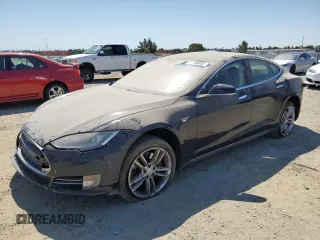 2013 Tesla Model S with VIN 5YJSA1AC9DFP10400, listed as a Copart auction lot 64096555 with 165,166 mi miles and Salvage title. Bid and sale history available at DreamBid. Image 1.