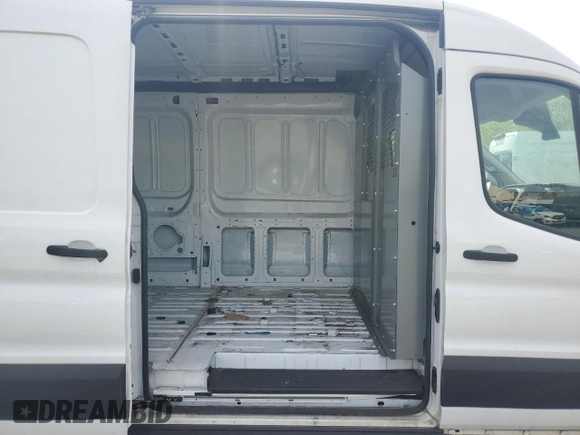 2021 Ford Transit Cargo с VIN 1FTBR1C81MKA80750, выставлен на аукционе Copart как лот 55567135 с пробегом 43 990 миль миль и Чистый • Clean title. История ставок и продаж доступна на DreamBid. Изображение 11.