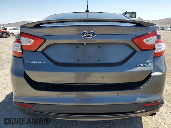2014 Ford Fusion SE Hybrid with VIN 3FA6P0LU3ER306739, listed as a Copart auction lot 69887454 with 114,150 mi miles and Salvage title. Bid and sale history available at DreamBid. Image 6.