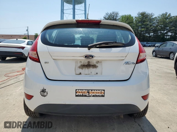 2012 Ford Fiesta SE z VIN 3FADP4EJ9CM148404, wystawiony jako Copart lot #59150695 z przebiegiem 84 705 mil mil oraz Czysty tytuł • Clean title. Historia ofert i sprzedaży dostępna na DreamBid. Obrazek 6.