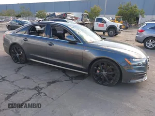 2014 Audi A6 3.0T Prestige with VIN WAUHGAFC7EN036961, listed as a IAAI auction lot 41741972 with 113,642 mi miles. Bid and sale history available at carsss.com. Image 1.