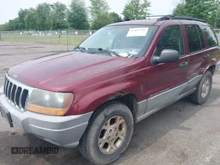 2000 Jeep Grand Cherokee Laredo z VIN 1J4GW48S2YC288439, wystawiony jako IAAI lot #42492798 z przebiegiem 272 527 mil mil oraz . Historia ofert i sprzedaży dostępna na DreamBid. Obrazek 2.