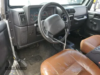 2002 Jeep Wrangler X с VIN 1J4FA39S52P770423, выставлен на аукционе Copart как лот 62498885 с пробегом 87 433 миль миль и Чистый • Clean title. История ставок и продаж доступна на DreamBid. Изображение 8.