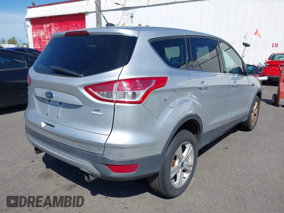 2013 Ford Escape SE with VIN 1FMCU9GX5DUB17091, listed as a IAAI auction lot 42047494 with 137,500 mi miles and . Bid and sale history available at DreamBid. Image 4.