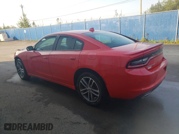 2019 Dodge Charger SXT with VIN 2C3CDXJGXKH611601, listed as a Copart auction lot 71523354 with 133,178 mi miles and Clean Title. Bid and sale history available at DreamBid. Image 2.