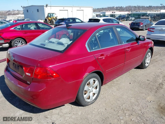 2009 Kia Optima LX with VIN KNAGE228X95314931, listed as a IAAI auction lot 41890304 with 217,901 mi miles. Bid and sale history available at carsss.com. Image 4.