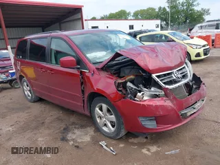 2011 Volkswagen Routan SE with VIN 2V4RW3DG4BR636014, listed as a IAAI auction lot 42452137 with 203,029 mi miles and . Bid and sale history available at DreamBid. Image 1.
